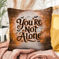 Indoor/outdoor mental health pillow with “You’re Not Alone” to promote comfort and support