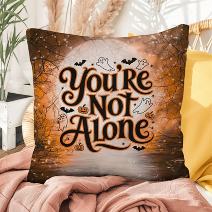 You're Not Alone message on a throw pillow promoting mental health awareness and encouragement