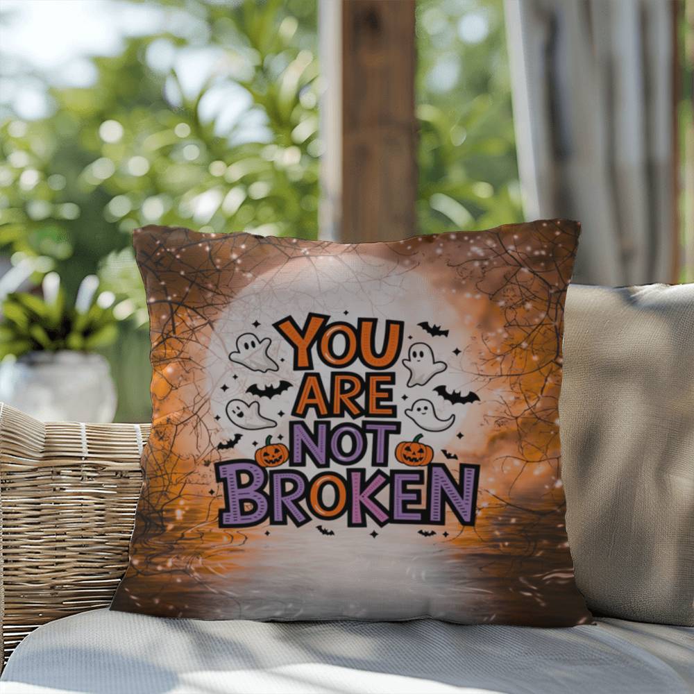 Indoor/outdoor pillow with “You Are Not Broken” for mental health awareness