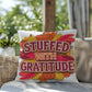 Stuffed With Gratitude throw pillow featuring Thanksgiving quote and warm fall seasonal décor accent