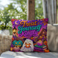 Treat Yourself Kindly message with self care inspired Halloween artwork on a decorative pillow