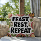 Feast, Rest, Repeat pillow featuring mindfulness message with cozy Thanksgiving and fall décor vibes