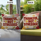 Thankful, Not Stressed pillow featuring uplifting Thanksgiving quote with autumn seasonal décor